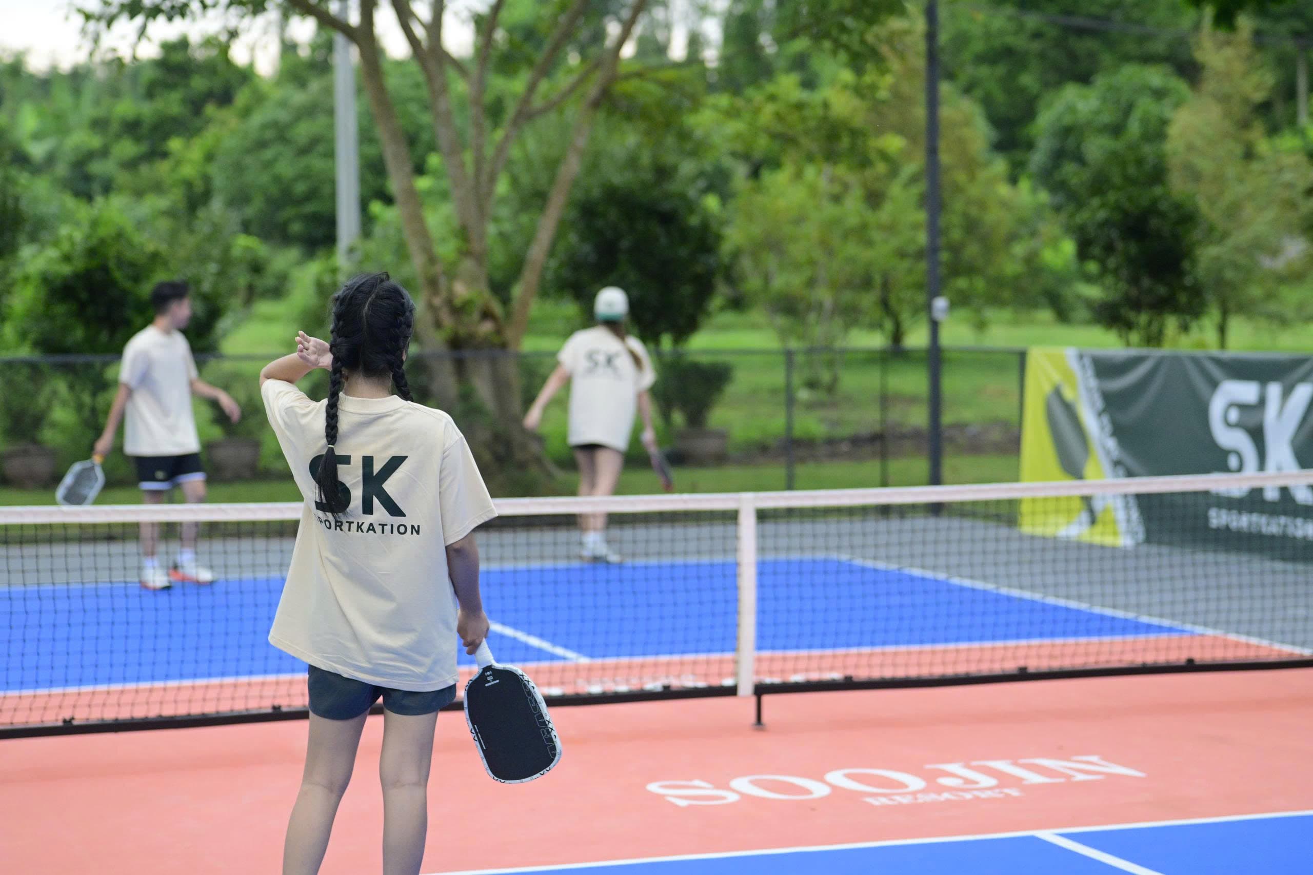 Participants playing pickleball at the first Sportkation training camp at Soojin Resort