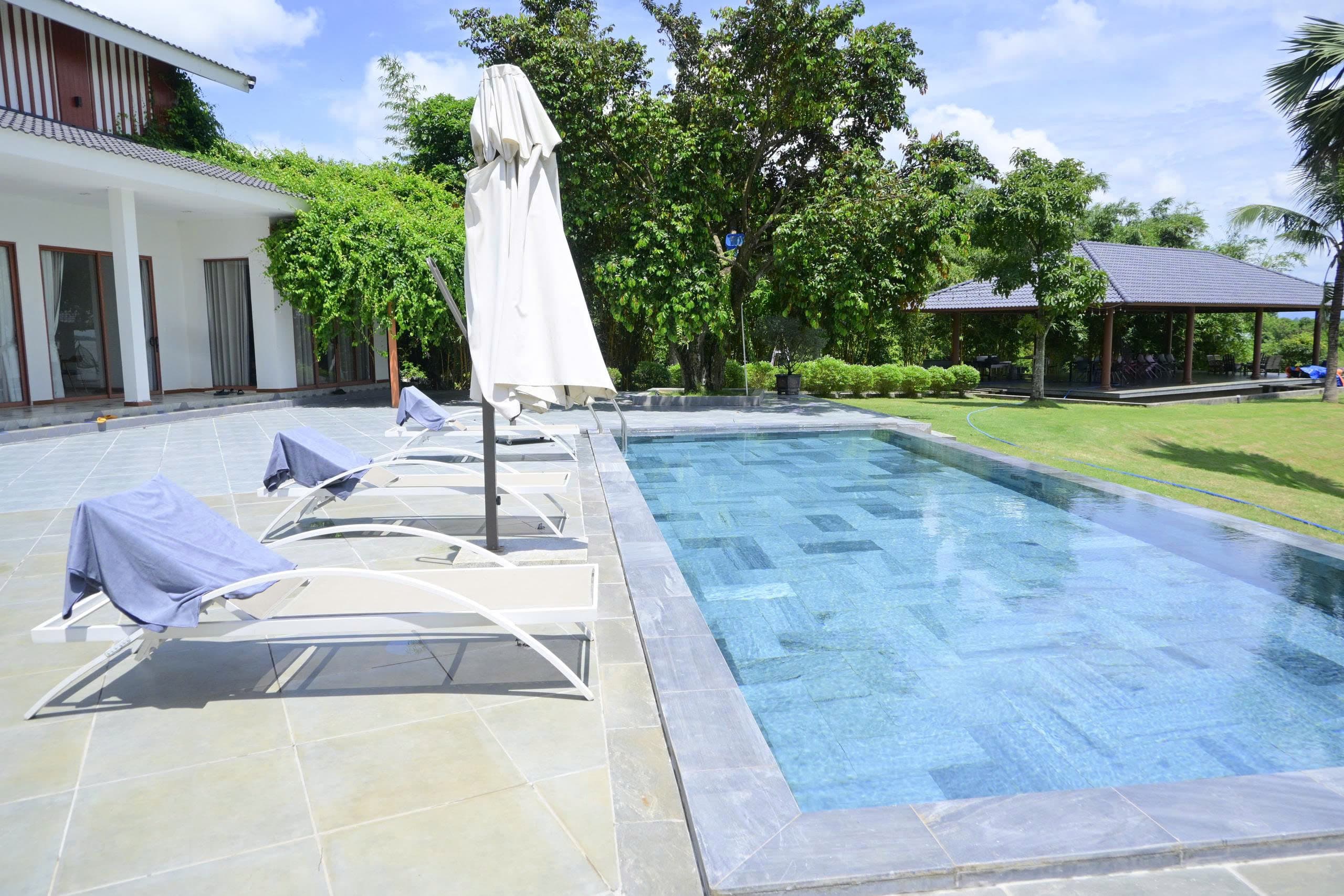 Pool and lounge chairs at Soojin Resort, photographed during the first Sportkation training camp