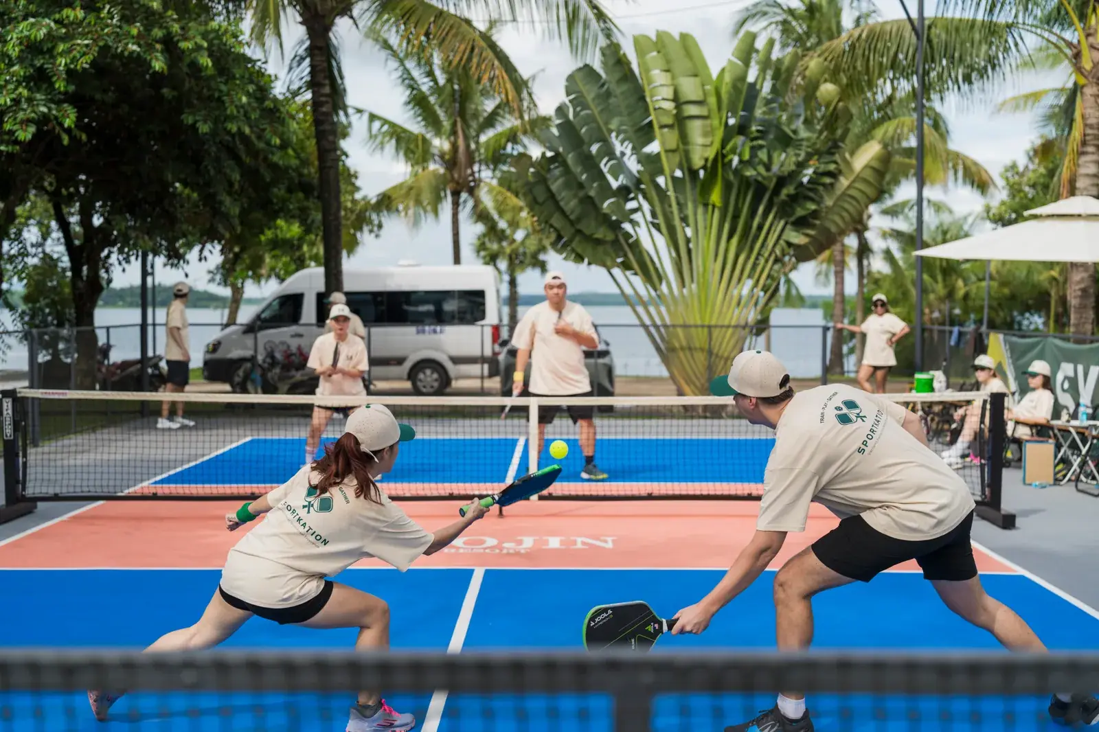 Sportkation participants playing doubles at Soojin Resort