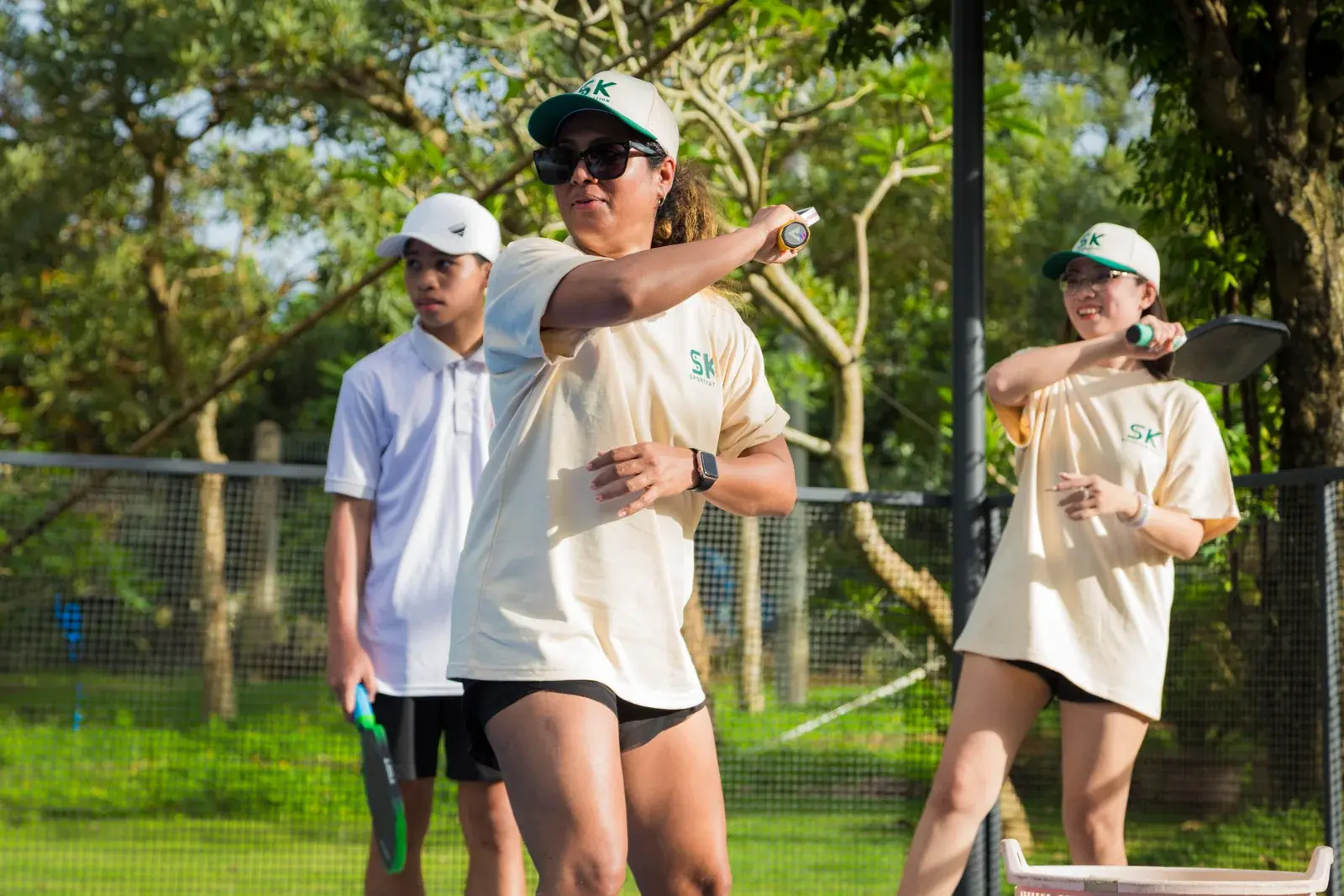 Players practising pickleball technique during a Sportkation session